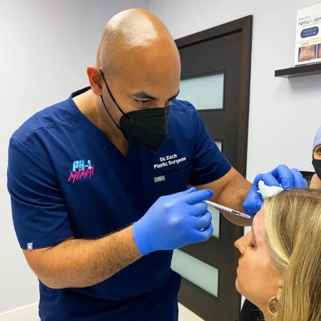 Dr Zachary Okhah of PH-1 performing surgery.